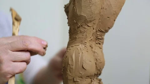 Sculptor Uses Tool To Sculpt Side Of Statue Stock Footage 72144510
