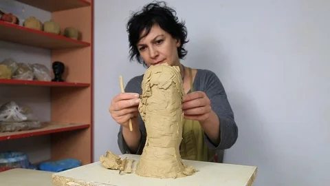Sculptor is working on the creation of a man's face.  Stock Footage 90866929