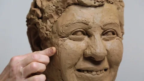 Sculptor working on the face details Stock Footage 72099170