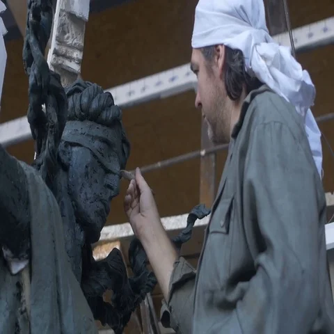 Sculptor working on his project Видео 69693887
