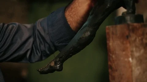 Sculptor working on a monument made of clay Stock Footage 81522708