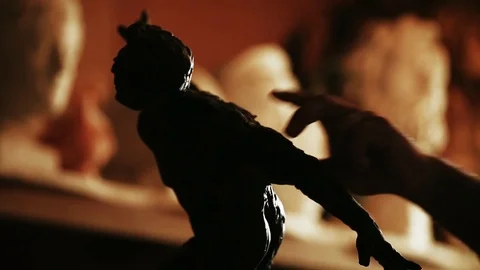 Sculptor working on a monument made of clay Stock Footage 81522722