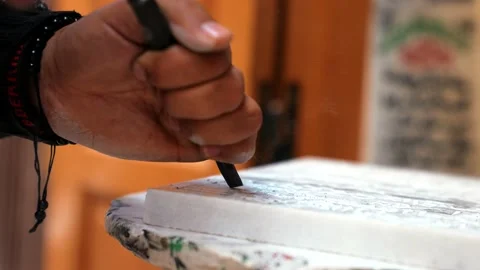 Sculptor working on a piece using hammer and chisel, sculpting a white marble Video stock 168995868