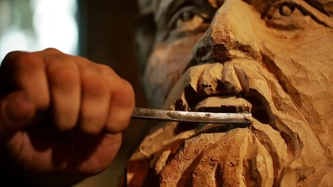 Sculptor working with wooden statue and carving wood Stock Footage 81509341