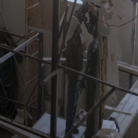 The sculptor works in a dark studio Stock Footage 69521290