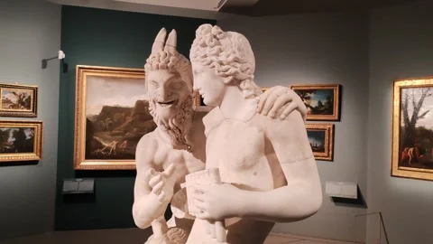Sculptural group of a satyr bewitching a young boy Stock Footage 300088364