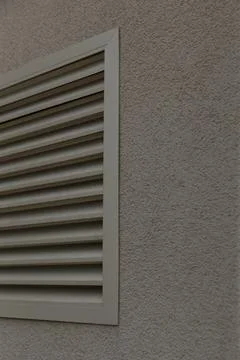 Sculptural shadow effects on textured wall with geometric louvers 写真素材
