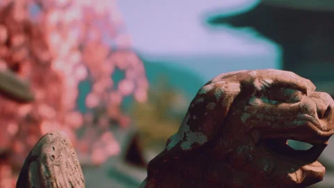 Sculpture with cherry blossoms in background at historic location 库存影片 343939384