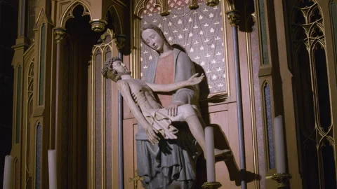 Sculpture composition in a gothic cathedral, the Virgin Mary holding the body Stock Footage 315407444