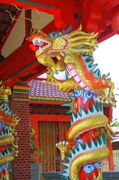 Sculpture of dragon on the red pole. Stock Photos
