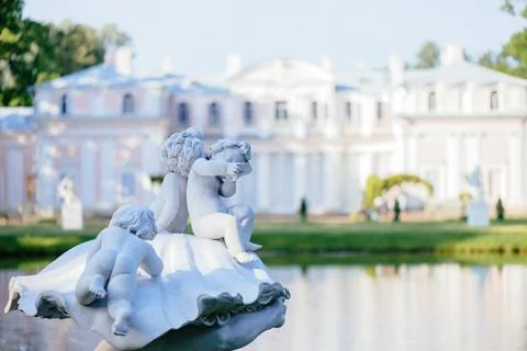 Sculpture element 'Triton Saving Children' on background of the Chinese Palace. Stock Photos
