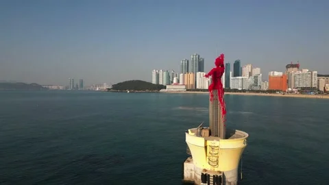 Sculpture at Haeundae beach with Skyscraper Video stock 239829971