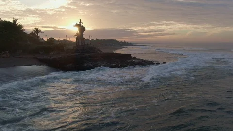 Sculpture on the ocean in the warm rays of dawn. Bali, Indonesia Stock Footage 112736187