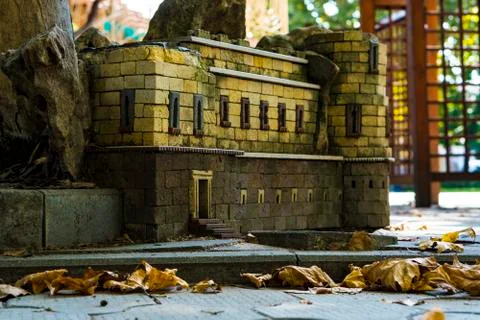 Sculpture or model of the building made of metal. Garden decorative building Stock Photos