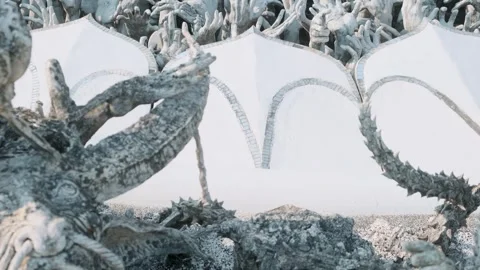 Sculpture of reaching hands symbolizing suffering and desire at the entrance of Stock Footage 315857526