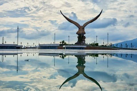 A sculpture of a red eagle spreading its wings. Popular tourist spot on Langk Stock Photos