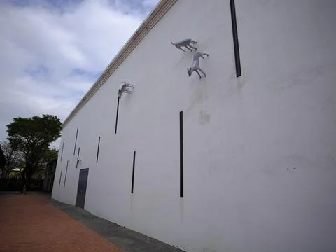 Sculpture side of building Stock Photos