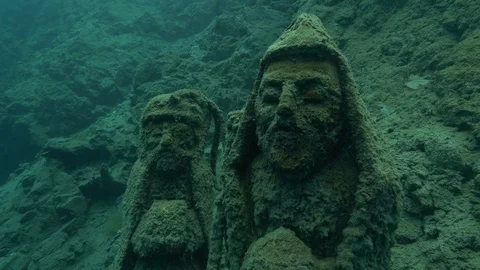 Sculpture of two characters at the bottom of the lake, San Domenico lake, Italy Stock Footage 104602219