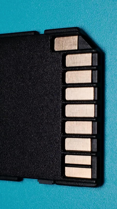 SD Card Contacts Macro Electronics Illumination on Blue Zoom Out Vertical Video Stock Footage 344817977