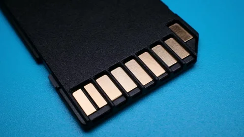 SD Card Metal Contacts Macro Data Electronics Illumination on Blue Video Stock Footage 344774778