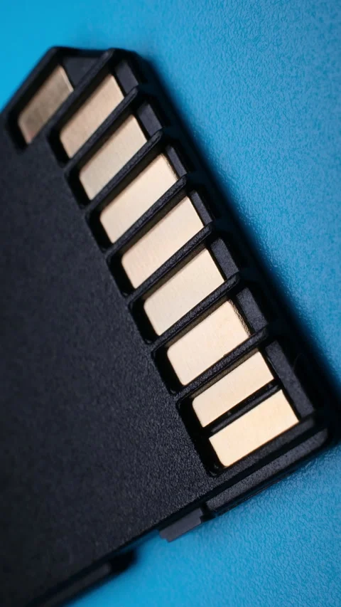 SD Card Metal Contacts Macro Data Electronics Illumination Vertical Video Stock Footage 344897688