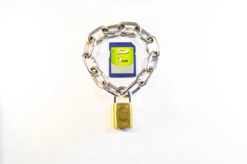 Sd memory card protected by a lock with a chain Stock Photos
