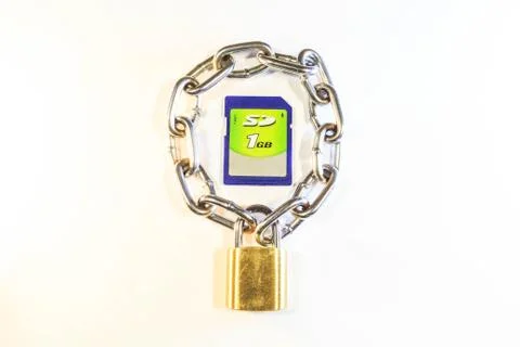 Sd memory card protected by a lock with a chain 스톡 사진