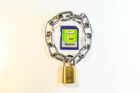 Sd memory card protected by a lock with a chain Stock Photos
