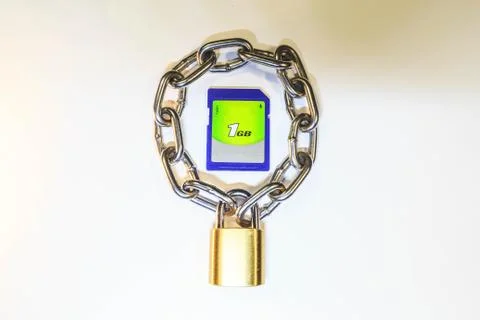 Sd memory card protected by a lock with a chain Stock Photos
