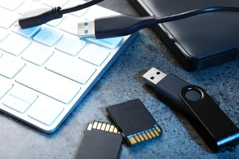 SD memory cards, USB flash drive, hard disk drive with cable and keyboard o.. Stock Photos