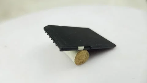 SDHC memory card on white rotating floor Video stock 276321214