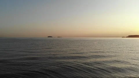 Sea and beach in the setting sun aerial footage from the air with a drone. Stock Footage 133763427