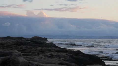 Sea and clouds during sunset, pan with boats and islands. Stock Footage 34134537