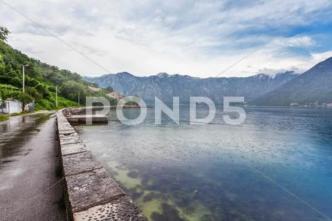 Sea and mountains in bad rainy weather Stock Photos