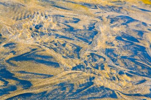 Sea and sand pattern stream water flowing, Aksa Beach, Malad, Bombay Mumba... Stock Photos