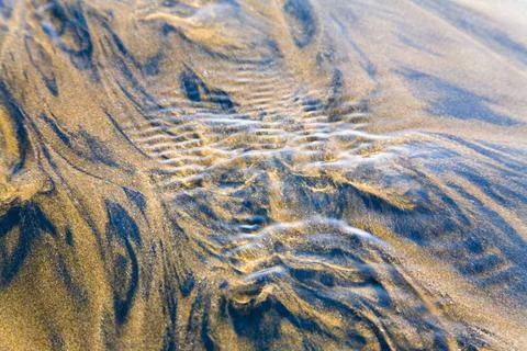 Sea and sand pattern stream water flowing, Aksa Beach, Malad, Bombay Mumba... Stock Photos