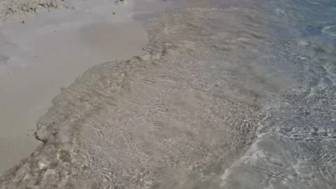 The sea and the sandy beach, the camera shoots near the water and moves forward Stock Footage 237592767