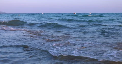 Sea and waves through a branch the Aegean sea in Greece Stockbeeldmateriaal 219497855