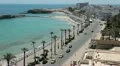 Sea avenue with palm trees along road HD Footage