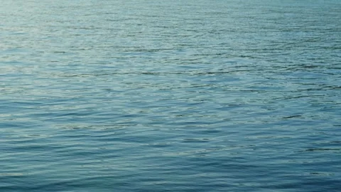 Sea background close up. Abstract view of the water surface of the ocean on a Video stock 276384115
