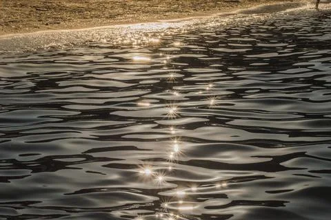 Sea background at sunset ,reflection of sunlight as stars. Stock Photos
