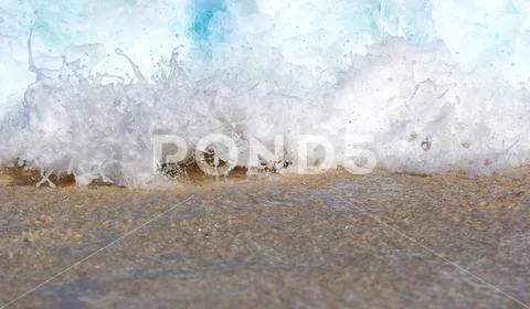 Sea Background, Wave Crashing on Sandy Beach Stock Photos