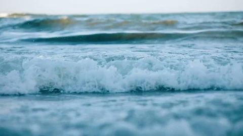 Sea beach coast beautiful big waves blue water bubbles weed plant horizon Stock Footage