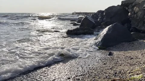 Sea beach in the evening, waves and interesting reflections. Stock Footage 330496774