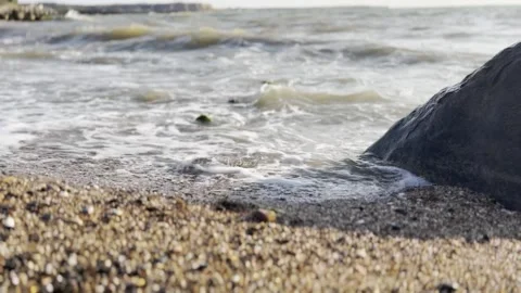 Sea beach in the evening, waves and interesting reflections. Stock Footage 330498515