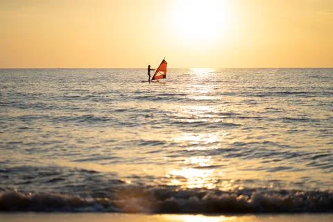 The sea, the beach in the evening when the sun goes down Stock Photos