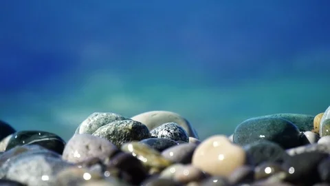 Sea beach of peebles with the foam of the waves in motion Stock Footage 80213640