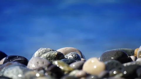 Sea beach of peebles with the foam of the waves in motion Stock Footage 80364682