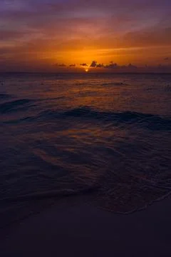 Sea beach with sky sunset or sunrise. Clouds over the sunset sea. Stock Photos