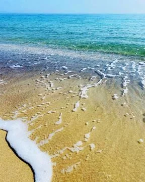 The sea is a beautiful unpredictable element, transparent, with blue hues Stock Photos